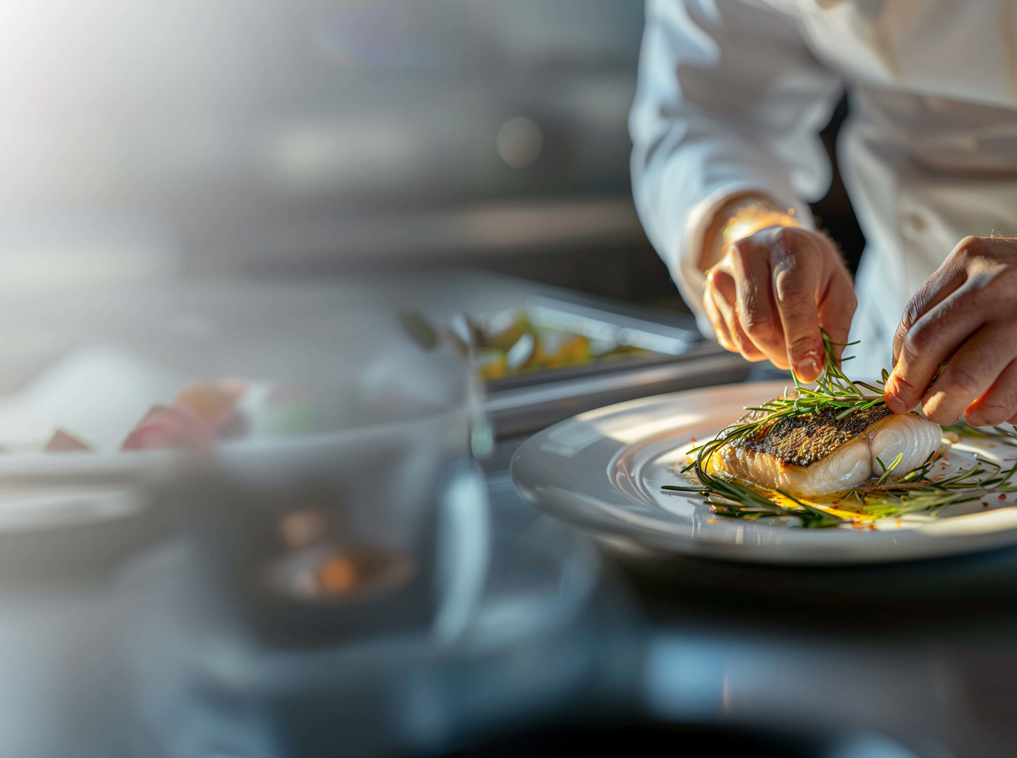 A chef prepares a fish dish