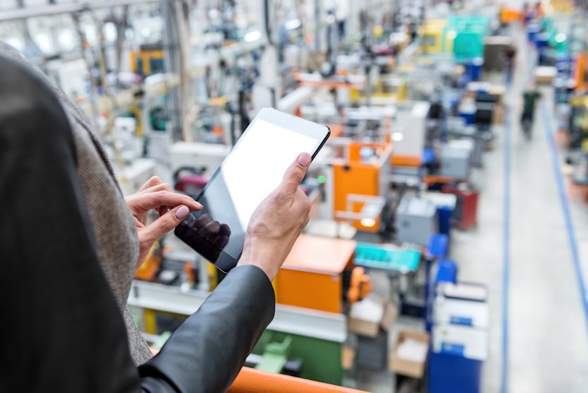 Woman in warehouse with tablet