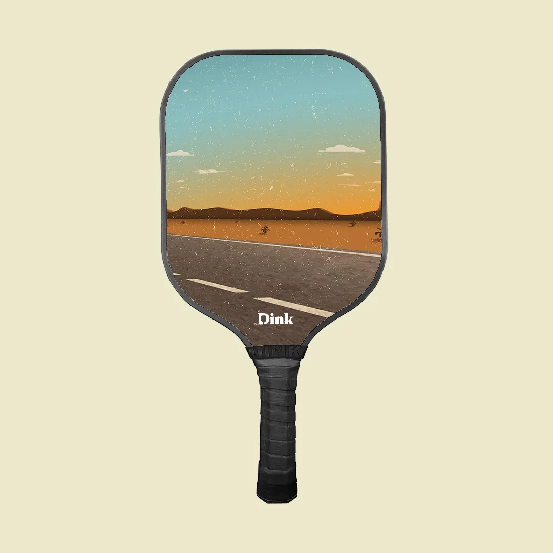 A custom pickleball paddle from Dink with a vintage road design
