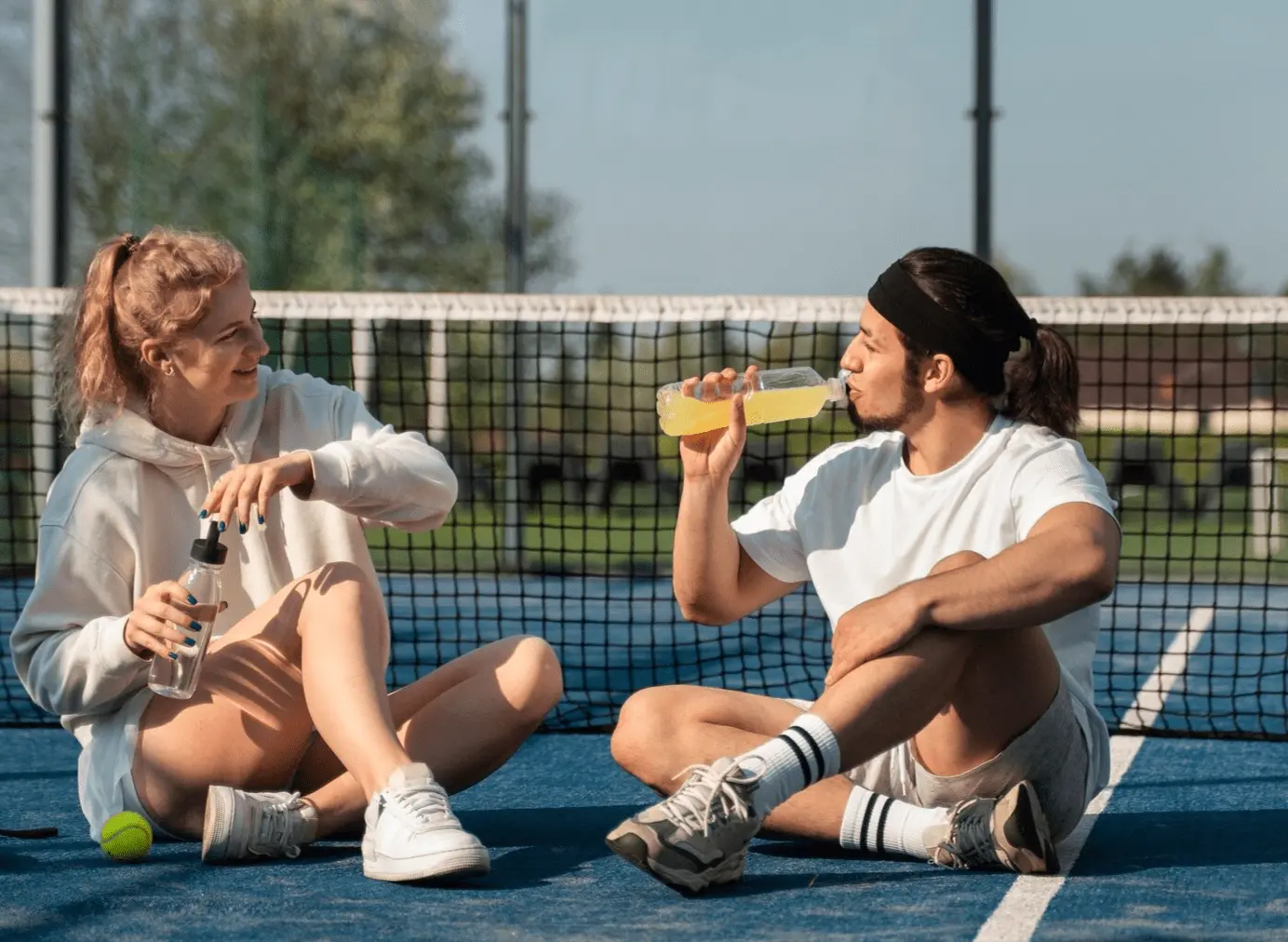 Two pickleball players resting during the game