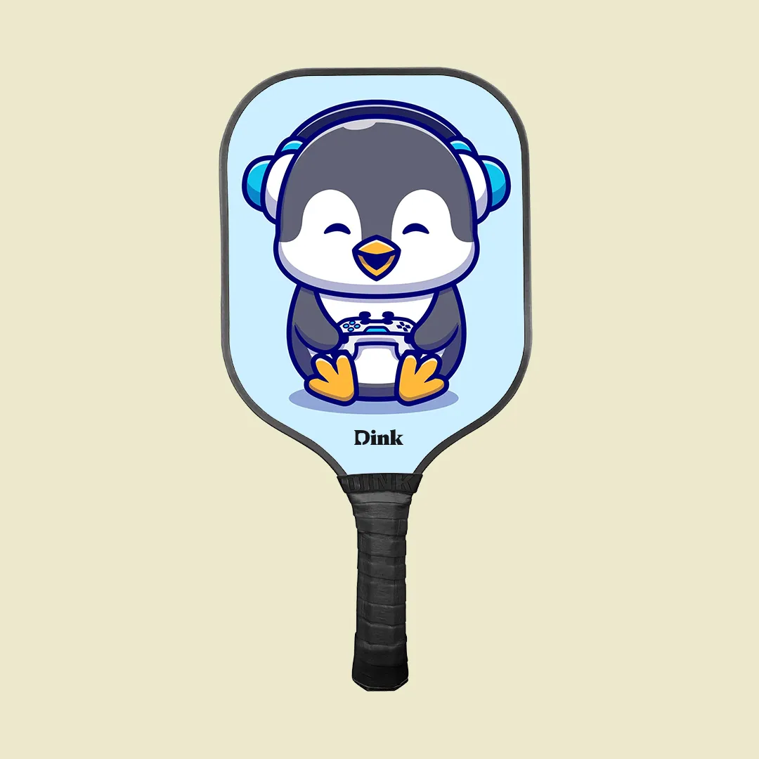 dink´s custom pickleball paddle with a cute penguin playing a video game