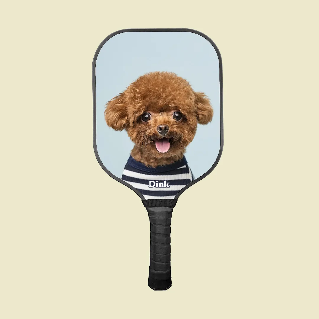 dink´s custom pickleball paddle with a cute dog in a striped sweater