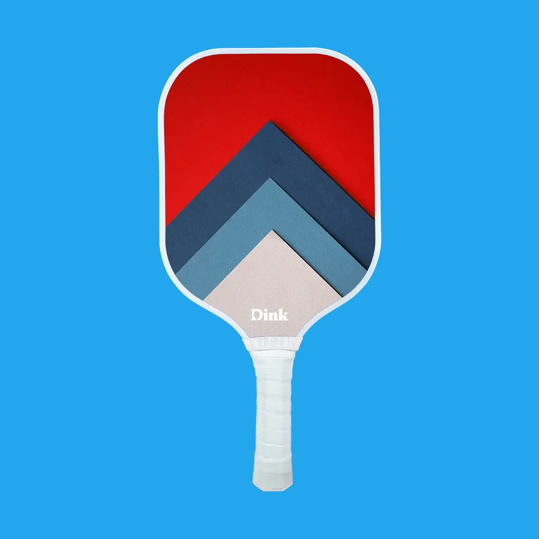 a custom pickleball paddle with vibrant red blue and pink graphics