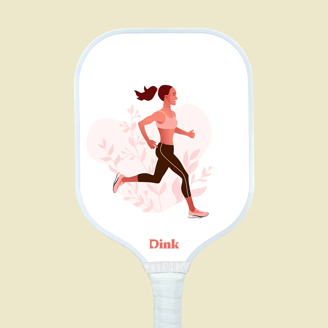 a custom pickleball paddle design with a running woman in pink