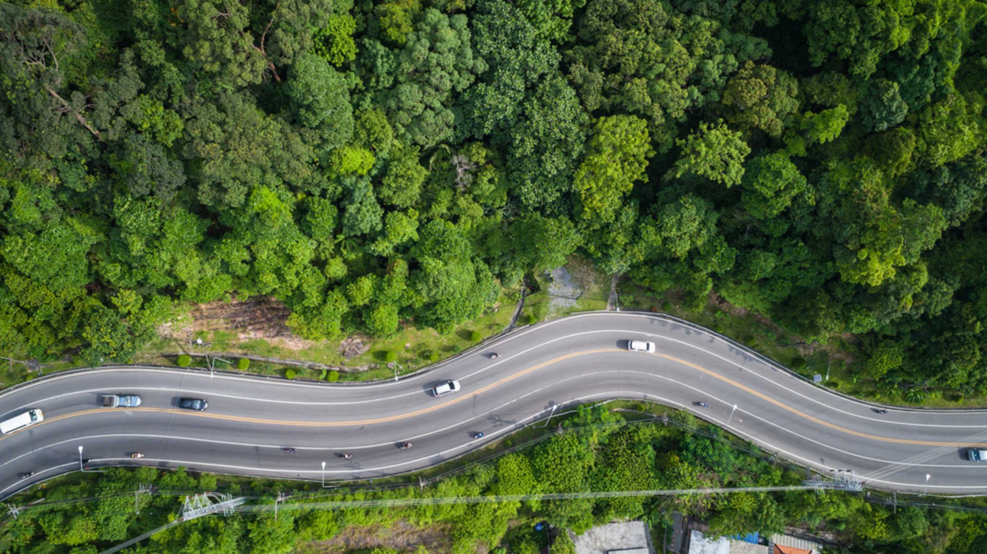 stock-photo-top-view-car-and-road-on-the-hill-in-phuket-thailand-aerial-view-from-flying-drone-633127292