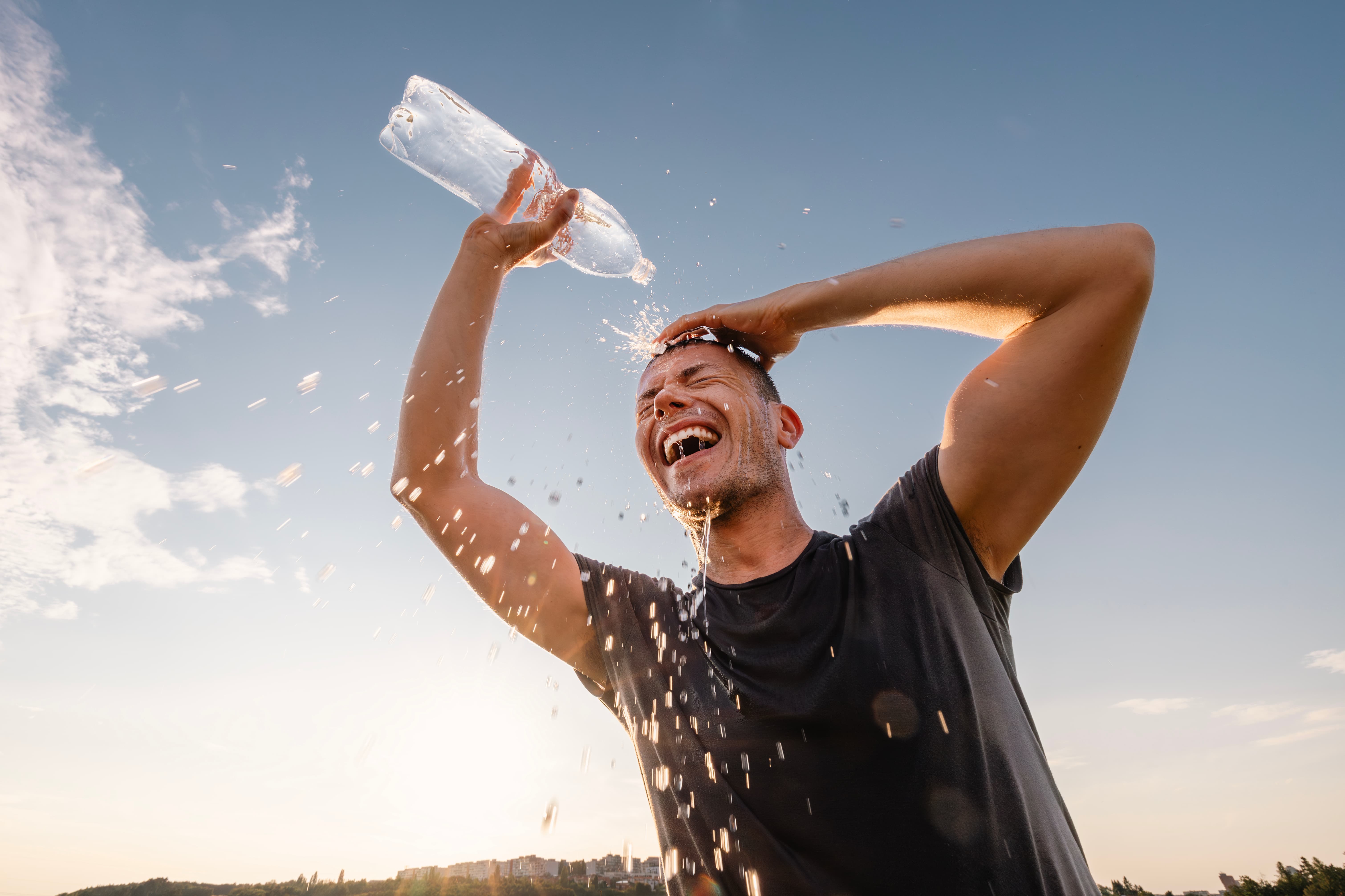 Person pouring water over their head.
