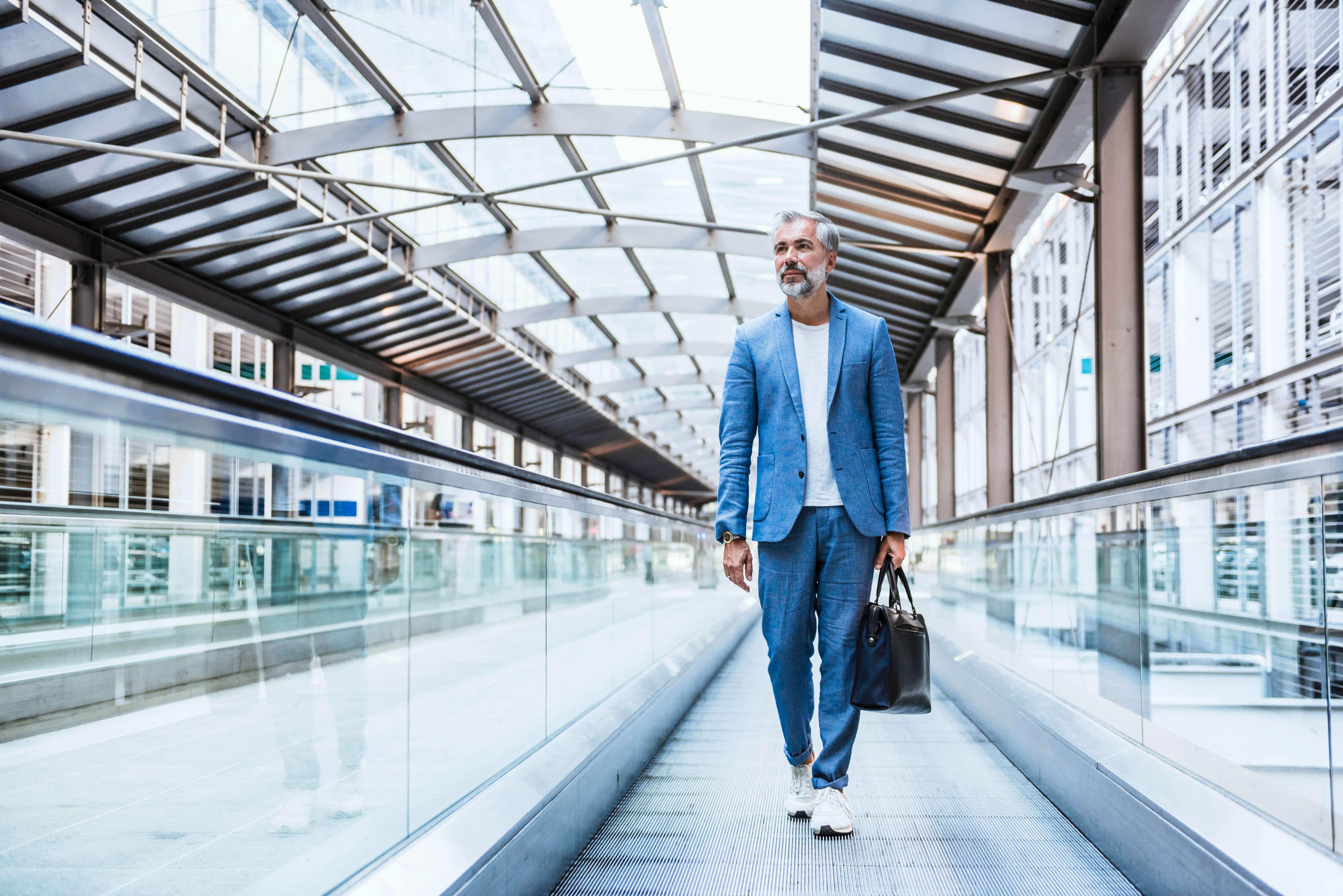 man walking through airport