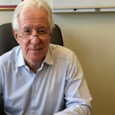 Portrait of Dr Graham Newstead in his office