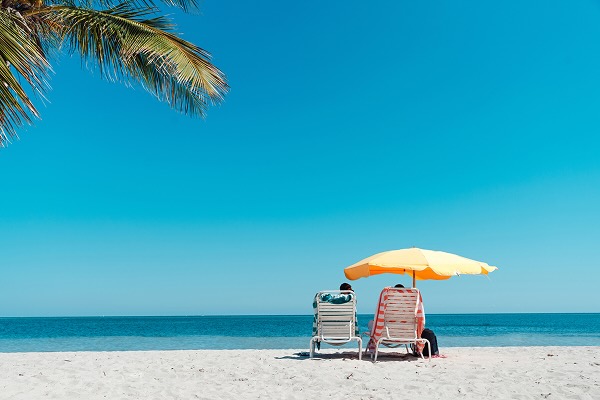 A couple sitting on a beach in Florida