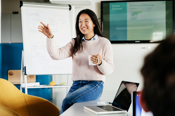 A woman leading a meeting in a boardroom
