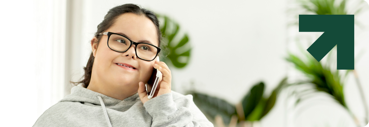 Woman with down syndrome talking on the phone