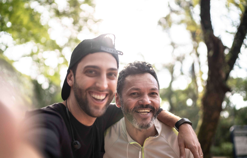 2 men taking a selfie out in nature