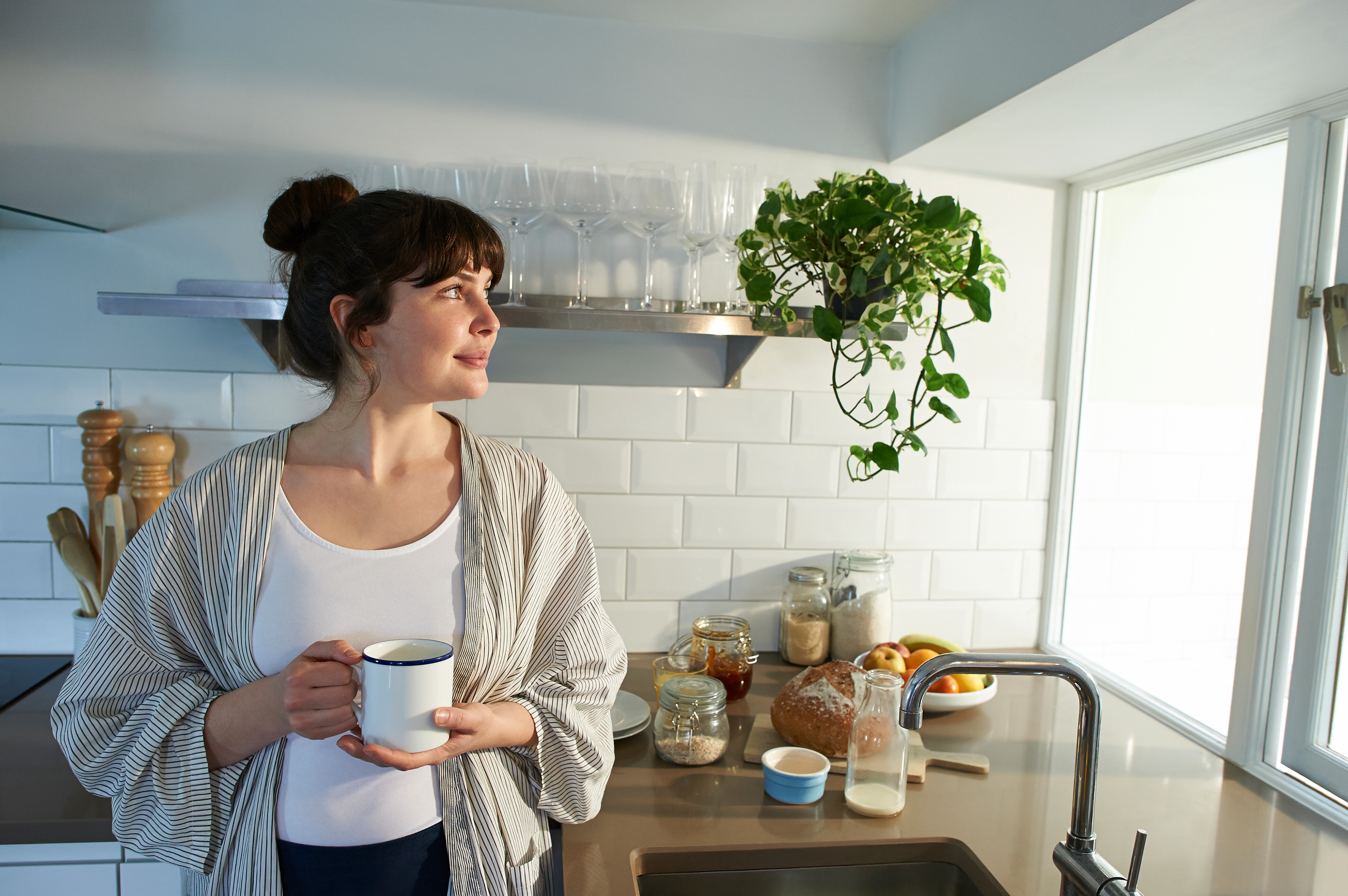 Woman standing in kitchen