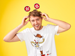 Roman Kemp smiling wearing Red Nose Day 2021 Ears
