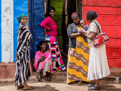 A group of women standing in the street