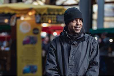 Man smiling and looking off-camera