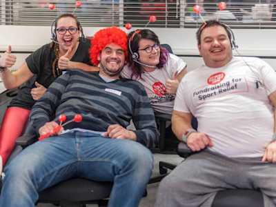 Saga staff smiling wearing deeley boppers