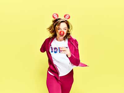 Person running wearing Red Nose Day merchandise