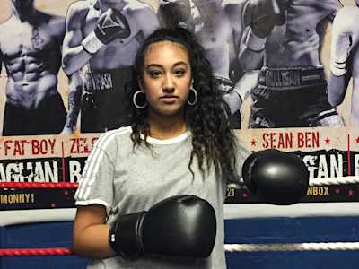 A woman in a boxing ring