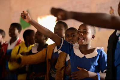 Girls at school making a pledge
