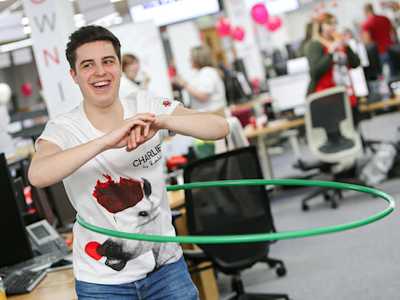 Worldpay employee smiling and hula-hooping