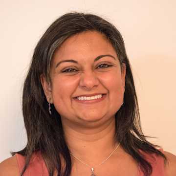 Aleema smiling.