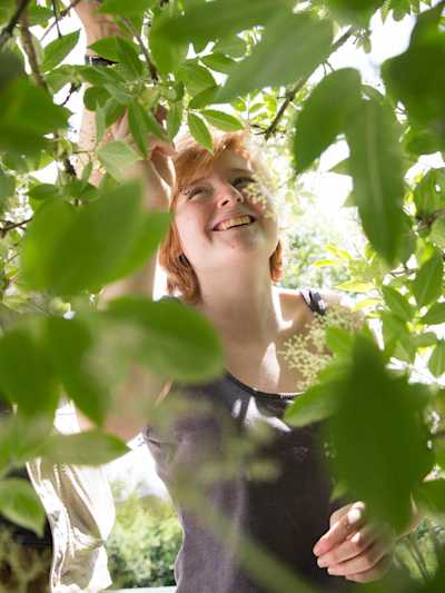 Woman picking herbs