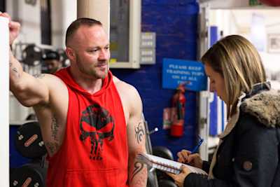 A woman interviews a man