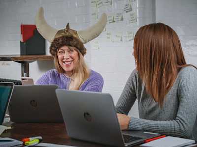 Office worker wearing a viking hat