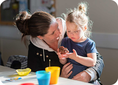 Parent teaching a small child