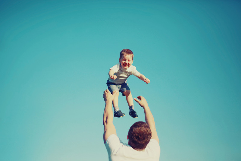 happy-father-and-child-having-fun-outdoors
