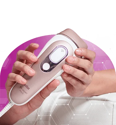 Hand holding a modern hair removal device with a sleek design against a colorful background