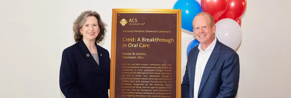 Mary and Michael pose with Plaque