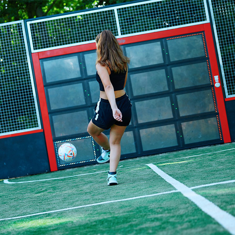 1442-NL-Sutu-Uiterwaarde de Meent-2021-274 (Large) Girl playing soccer on the Lappset Sutu Interactive ball wall