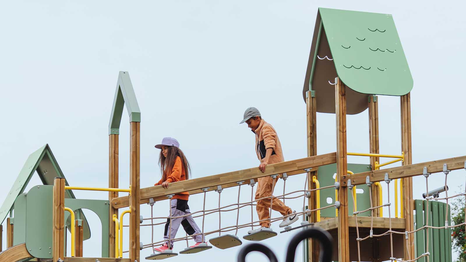 Prime playground girl and boy on a bridge
