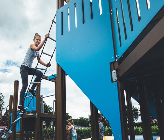 Girl climbing the spinning ladders