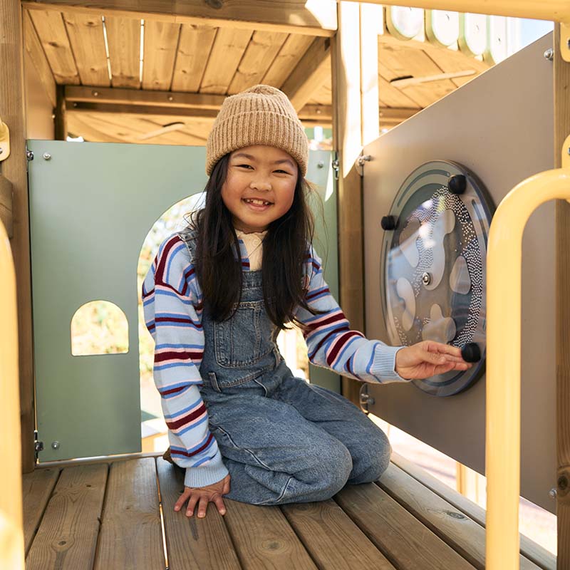 Girl playing on a Prime playground