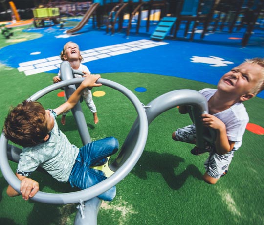Children spinning in the Xroll carousel
