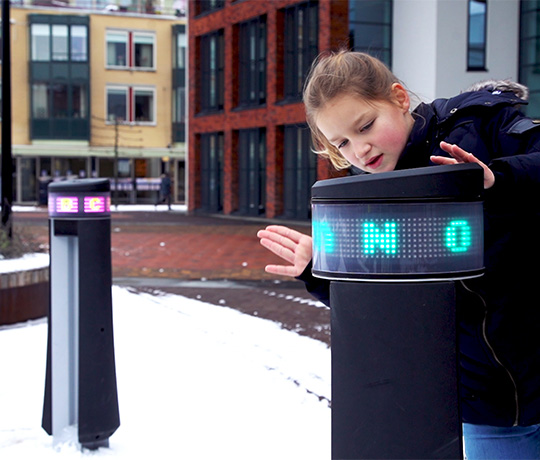 900 NL Memo Europaplein 2018 A girl playing in the snow on the Lappset Memo Interactive play pillars