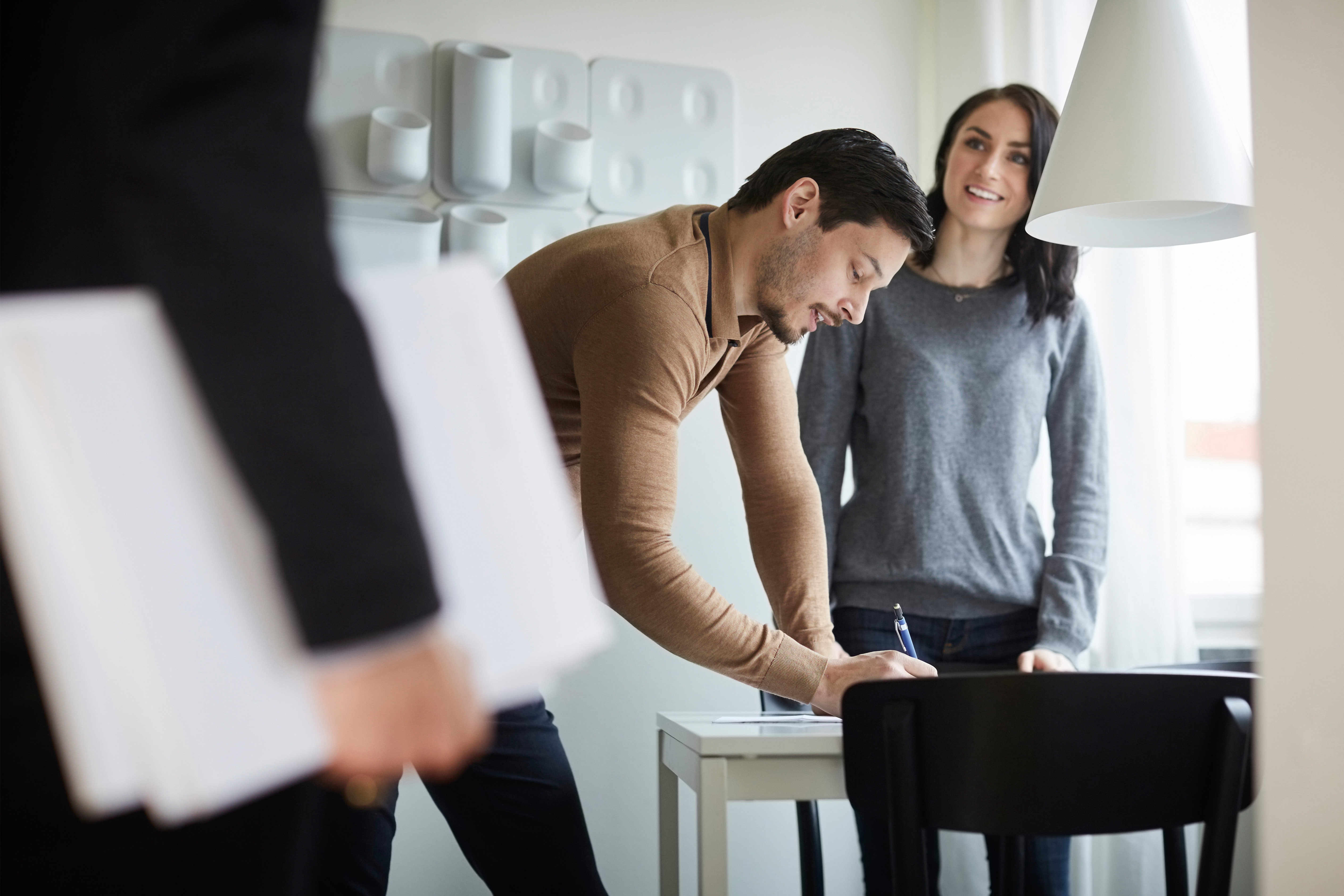 couple signing paperwork