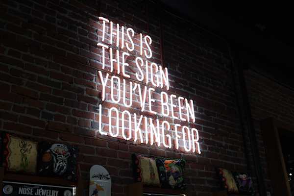 Neon Sign Noen sign that says "This is the sign you've been looking for"
