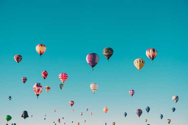 Hot Air Balloons Dozens of hot air balloons against a blue sky