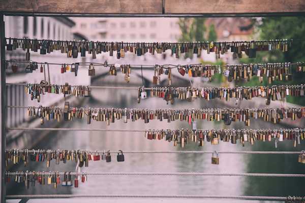 Padlocks on bridge Dozens of padlocks attached to a bridge.