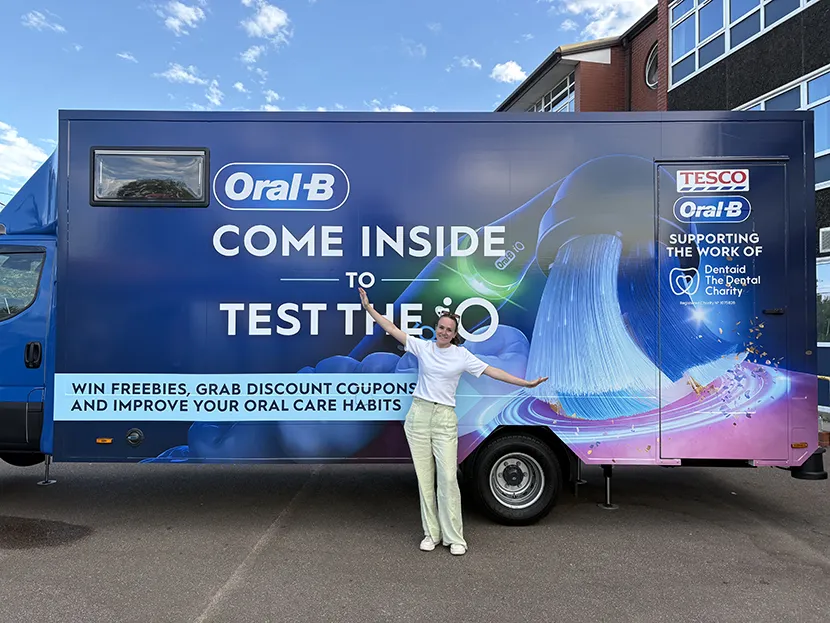 Oral-B Brush for Better bus featuring oral health campaign messaging and support for Dentaid The Dental Charity.
