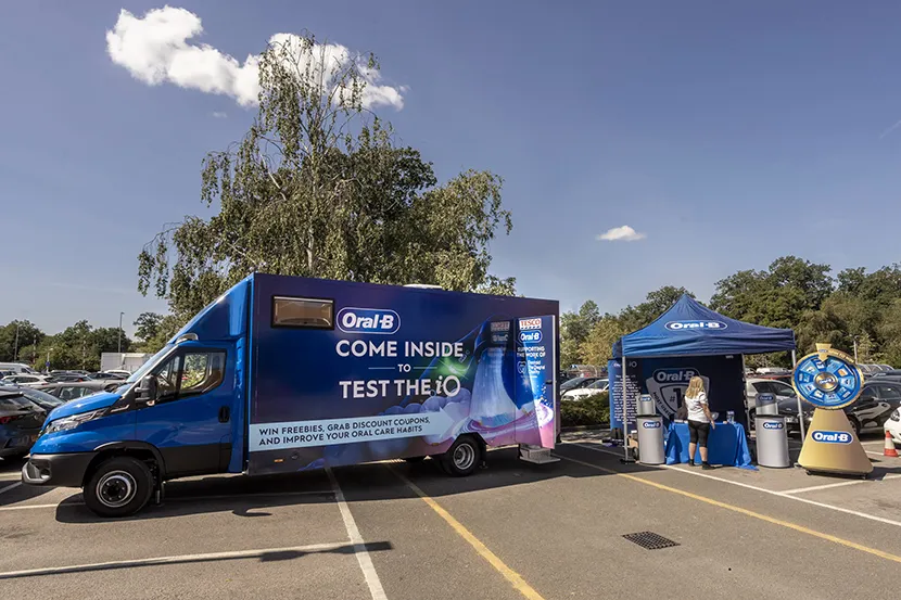 Oral-B Brush for Better mobile dental bus and information stand during a community oral health event in the UK.