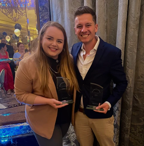 Amy Nicklin & Matt Thomas holding their ISBA President’s Awards at the Awards Ceremony.