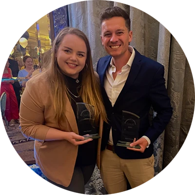 Amy Nicklin & Matt Thomas holding their ISBA President’s Awards at the Awards Ceremony.