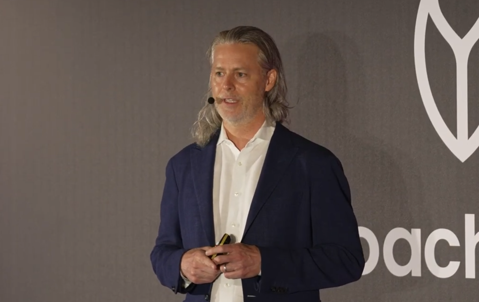 Cockroach Labs speaker presenting on stage