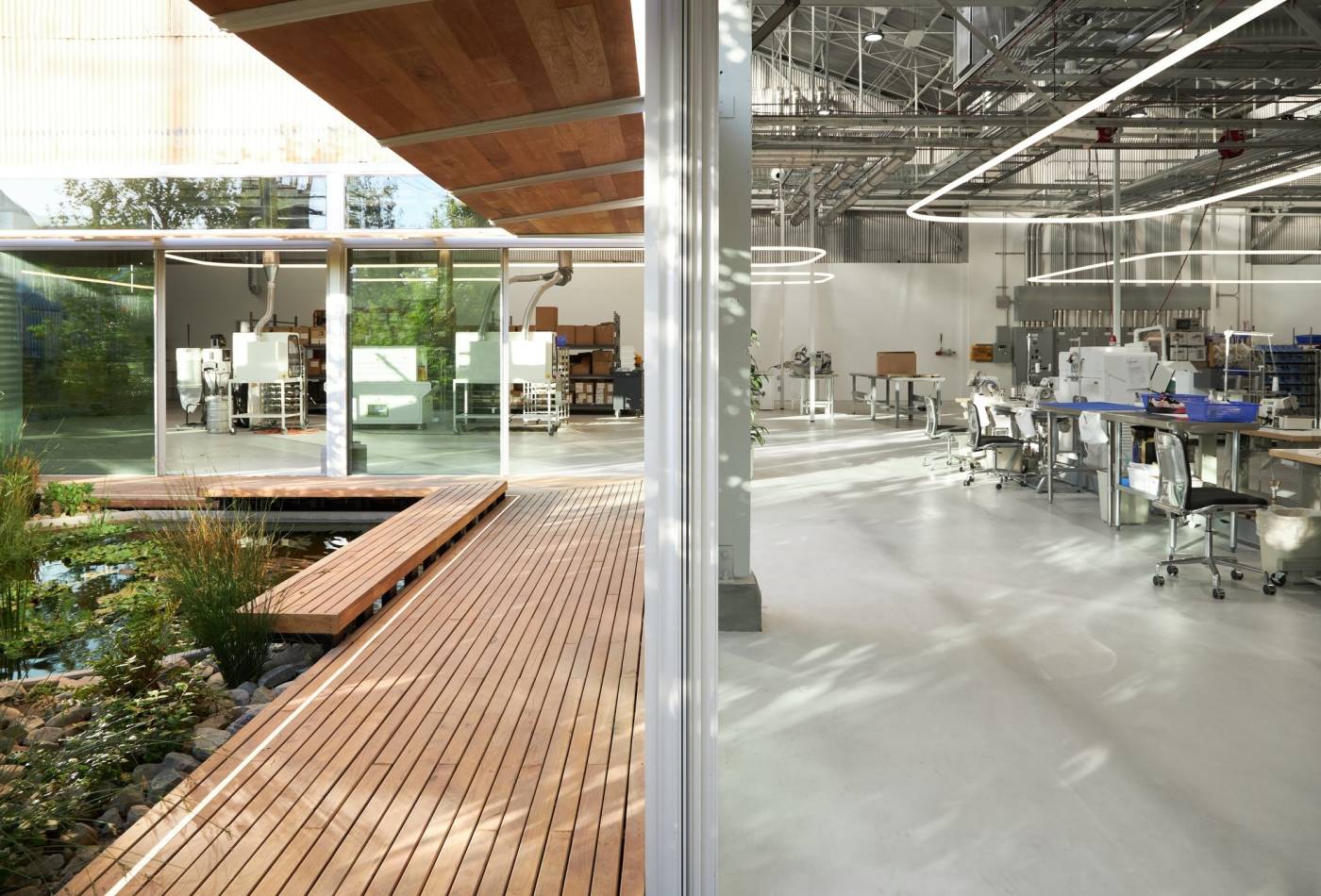 Set within an industrial Los Angeles neighborhood, KX Lab shrouds its unconventional tech-filled design within a typical warehouse exterior and sets out to change the way manufacturing is carried out in Los Angeles. The design focus supports a social mission where technology and people interconnect. 
<br><br>
The facility seamlessly merges a knit manufacturing space with workspace, research and development, retail environment, and exhibition space. KX Lab sees its new home as a prototype for “radically more humane” manufacturing environments focused on sustainability and transparency. As a local manufacturer, KX Lab aims to bring consumers, products, and the people that make them closer together.