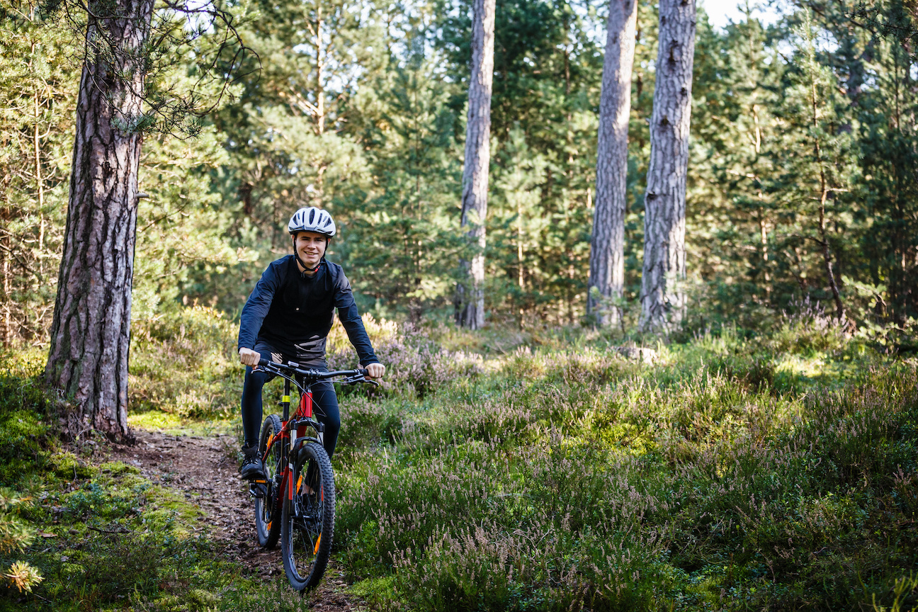 A person performing cardio such as jogging or bike riding.